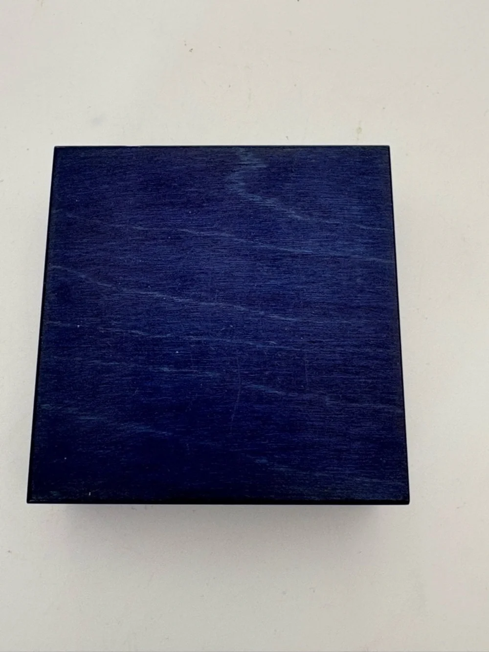 Bright Yellow Sun on Deep Blue Wooden Box